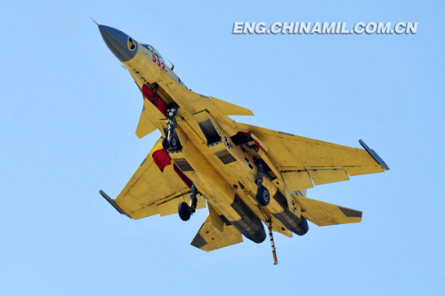 Recently, China's independently-developed carrier-borne J-15 fighters conducted test flights on such subjects as the landing with arresting cable and the ski-jump takeoff on the Liaoning aircraft carrier. As a China's independently-developed carrier-borne multi-purpose-type fighter, the J-15 fighter can carry various types of precision-guided weapons with long-range attack and round-the-clock fighting capacities. (chinamil.com.cn/ Li Tang)
