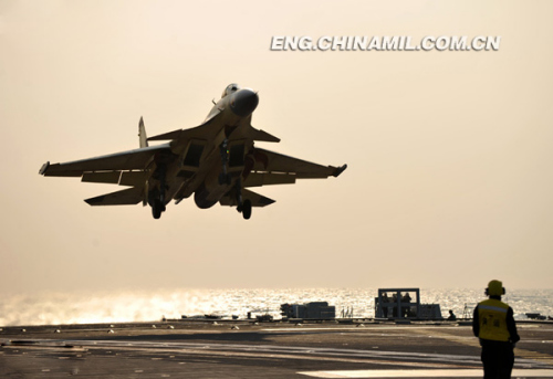 Recently, China's independently-developed carrier-borne J-15 fighters conducted test flights on such subjects as the landing with arresting cable and the ski-jump takeoff on the Liaoning aircraft carrier. As a China's independently-developed carrier-borne multi-purpose-type fighter, the J-15 fighter can carry various types of precision-guided weapons with long-range attack and round-the-clock fighting capacities. (chinamil.com.cn/ Li Tang)