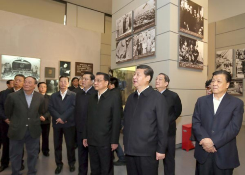 Xi Jinping, general secretary of the Communist Party of China (CPC) Central Committee, views The Road Toward Renewal exhibition in Beijing Thursday,  along with other members of the Standing Committee of the CPC Central Committee Political Bureau.[Ju Peng/Xinhua]