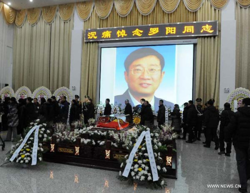 People attend a memorial service for Luo Yang, head of the production phase for China's new J-15 fighter jet, who died of a heart attack on Nov. 25, in the Huilonggang Cemetery for Revolutionaries in Shenyang, capital of northeast China's Liaoning Province, Nov. 29, 2012. Luo experienced a heart attack after observing aircraft carrier flight landing tests for China's first aircraft carrier, the Liaoning, on Nov. 25. He later died in hospital at the age of 51. He was also chairman and general manager of Shenyang Aircraft Corp. (SAC), a subsidiary of China's state-owned aircraft maker, Aviation Industry Corp. of China (AVIC). (Xinhua/Li Gang)