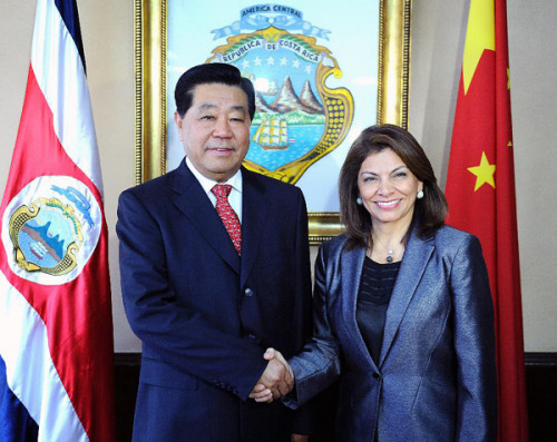 Jia Qinglin (L), chairman of the National Committee of the Chinese People's Political Consultative Conference (CPPCC), meets with Costa Rican President Laura Chinchilla in San Jose, Costa Rica, Dec. 4, 2012. (Xinhua/Liu Jiansheng) 