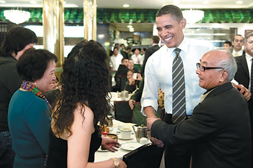 President Barack Obama greets patrons during a visit to the Great Eastern Restaurant in San Francisco's Chinatown. [Photo/Provided to China Daily]