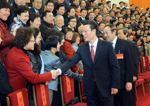 Zhang Gaoli (R, front), a member of the Standing Committee of the Political Bureau of the Communist Party of China (CPC) Central Committee, shakes hands with delegates before the opening of the 11th National Congress of the China Democratic League (CDL) in Beijing, capital of China, Dec. 9, 2012. (Xinhua/Li Tao) 
