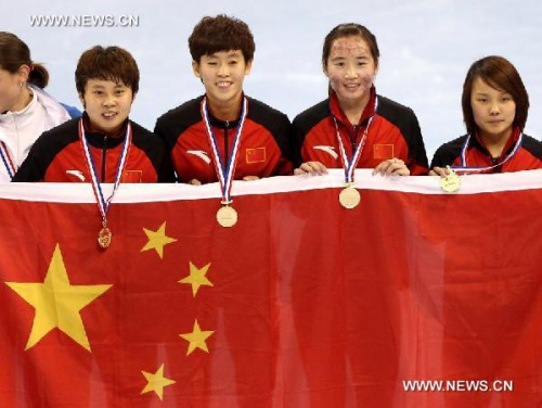 Wang Meng (L 1st), Fan Kexin (L 2nd), Li Jianrou (R 1st) and Kong Xue of China celebrate victory during the awarding ceremony of the women's 3000m relay final during the ISU Short Track World Cup speed skating competition in Shanghai, China, on Dec. 9, 2012. China claimed the title with a time of 4 minutes 7.660 seconds. (Xinhua/Fan Jun)