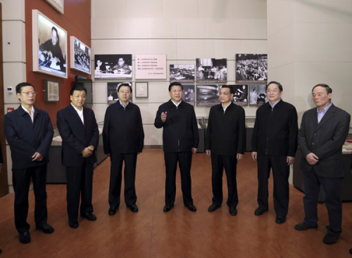 Xi Jinping (center), general secretary of the Communist Party of China Central Committee and the members of the Political Bureau of the CPC Central Committee, at The Road Toward Renewal exhibition in Beijing in November. [Photo/Xinhua]