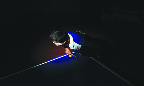 Xiao Chao, 15, from Changsha Special Education School, practises table tennis for vision-impaired people. Photo: Gu Pengbo