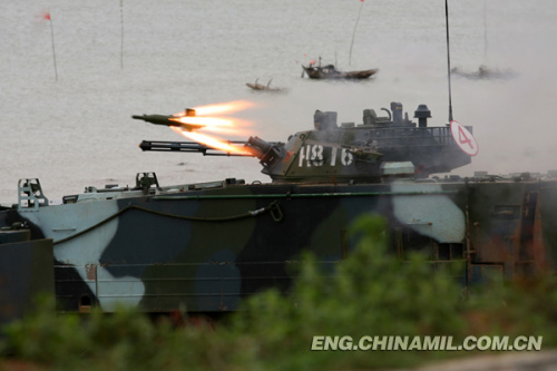 A brigade of the Marine Corps under the Navy of the Chinese Peoples Liberation Army (PLA), which was praised as land tiger, sea dragon and air eagle, carried out a series of amphibious armored training at the end of the year 2012 so as to solve the bottleneck problems in assessment. The photo shows the splendid moment of training. (China Military Online/Li Tang)