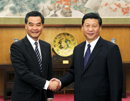 Xi Jinping (R), general secretary of the Communist Party of China Central Committee, meets with CY Leung, chief executive of the Hong Kong Special Administrative Region, in Beijing, capital of China, Dec. 20, 2012. Leung is in Beijing to brief officials on Hong Kong's latest economic, social and political developments. (Xinhua/Rao Aimin)