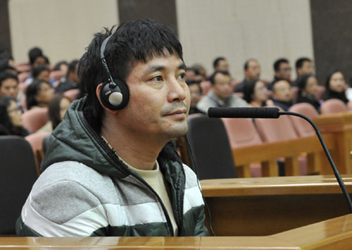 Naw Kham, head of the gang that murdered 13 Chinese sailors on the Mekong River last year, attends a court session at the Yunnan Provincial Higher People's Court on Thursday. LIU XUEBIN / FOR CHINA DAILY