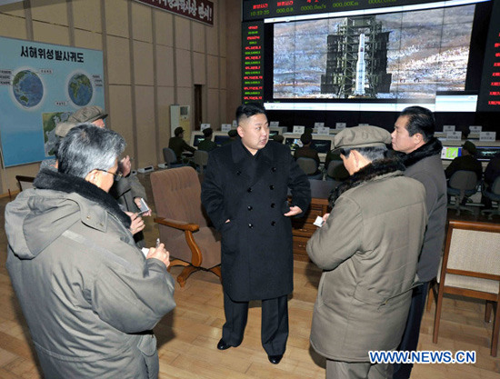 Photo released by Korean Central News Agency (KCNA) on Dec. 16, 2012 shows Kim Jong Un (C), top leader of the Democratic People's Republic of Korea (DPRK), congratulate recently on scientific workers of the second Kwangmyongsong-3 satellite launch project at Sohae Space Center in Cholsan County, North Phyongan Province, DPRK. (Xinhua/KCNA File Photo)