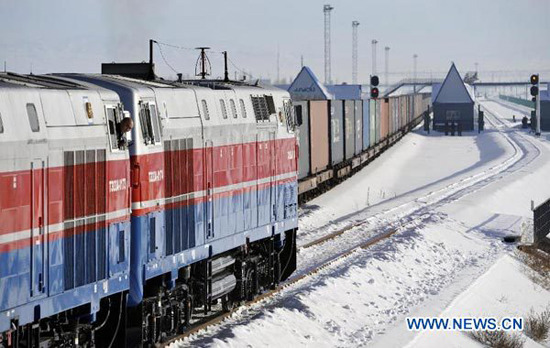 Trains linking Korgas Pass of China and Sary-Ozek railway of Kazakhstan start to move during the ceremony to celebrate the opening of the second crossborder rail line that links China's Xinjiang region and Kazakhstan, in Korgas, northwest China's Xinjiang Uygur Autonomous Region, Dec. 22, 2012. (Xinhua/Zhao Ge)