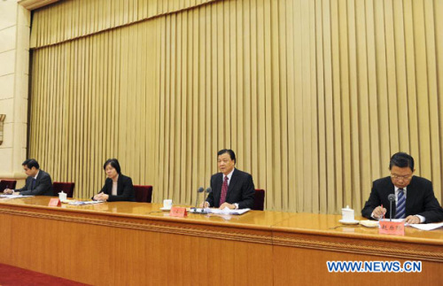 Liu Yunshan (2nd R), a member of the Standing Committee of the Political Bureau of the Communist Party of China (CPC) Central Committee and member of the Secretariat of the CPC Central Committee, addresses a meeting of local CPC organization department chiefs in Beijing, capital of China, Dec. 26, 2012. (Xinhua/Rao Aimin)