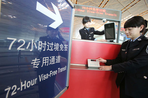 Officers examine equipment at Beijing Capital International Airport designed to process foreign visitors who can make 72-hour visa-free trips to the city from Jan 1. Shanghai is also undertaking preparations to offer the same service to international travelers. CAO BOYUAN / FOR CHINA DAILY