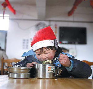 A child eats lunch at Light Love Family. 