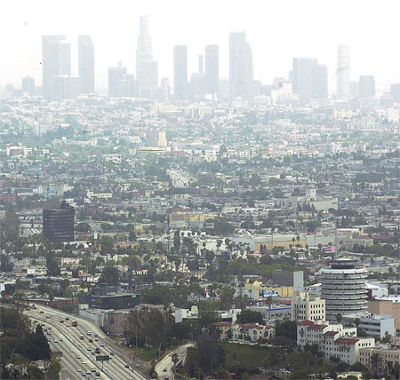 The skyline of Los Angeles obscured by a heavy layer of smog and fog on July 15, 2003. Provided to China Daily