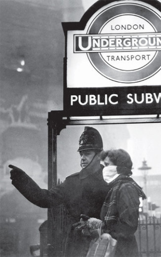 A policeman assists a woman during a dense London fog in 1953. Provided to China Daily 