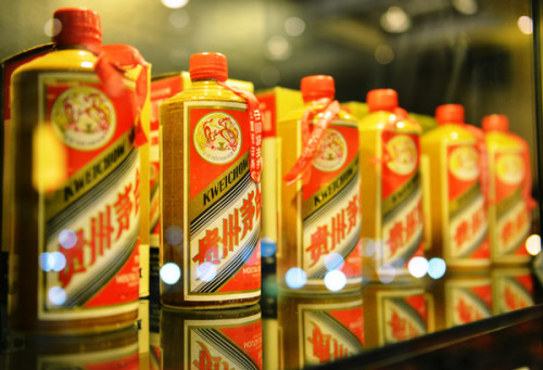 Bottles of famous Chinese liquor Moutai stand at a wine auction in Hangzhou, East China's Zhejiang province on Dec 29, 2012. The liquor produced in 1983 was sold at 780,000 yuan ($125,500) at the auction. [Long Wei/Asianewsphoto]