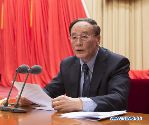 Wang Qishan, a member of the Standing Committee of the Political Bureau of the Communist Party of China (CPC) Central Committee and also secretary of the CPC's Central Commission for Discipline Inspection (CCDI), presides over a plenary meeting of the CCDI in Beijing, capital of China, Jan. 22, 2013. (Xinhua/Li Xueren)