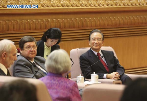 Chinese Premier Wen Jiabao (1st R) attends a seminar with representatives of foreign experts and their relatives in Beijing, capital of China, Jan. 31, 2013. Wen extended greetings to the foreign experts and their families at the seminar on Thursday prior to the Chinese Lunar New Year. (Xinhua/Ding Lin)