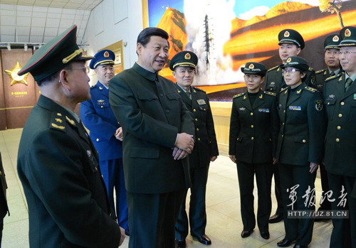 Xi Jinping, general secretary of the Central Committee of the Communist Party of China (CPC) and also chairman of the CPC Central Military Commission, visits the technical workers and servicemen of the Jiuquan Satellite Launch Center (JSLC), and lays flower basket at the Dongfeng Cemetery of Revolutionary Martyrs of the JSLC on February 2, 2013.