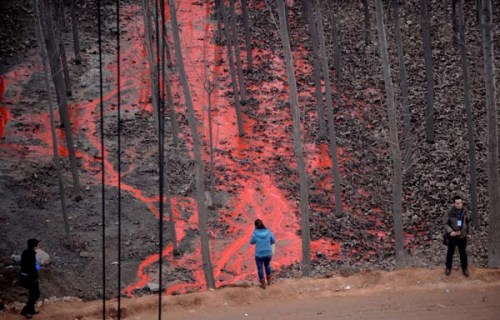 A pool of paint, that came from an overturned truck, gathers by a partially collapsed highway bridge on the Lianhuo highway in Mianchi county, Henan province Feb 1, 2013. [Photo by Xinhua]