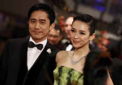 Actors Tony Leung Chiu Wai (L) and Zhang Ziyi arrive for the screening of the movie Yi Dai Zong Shi, The Grandmaster at the 63rd Berlinale International Film Festival in Berlin February 7, 2013. [Agencies]