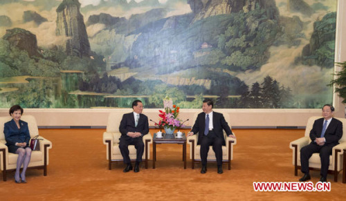 General Secretary of the Communist Party of China (CPC) Central Committee Xi Jinping (2nd R) meets with visiting Honorary Chairman of the Kuomintang Lien Chan (2nd L) at the Great Hall of the People in Beijing, Feb. 25, 2013. (Xinhua/Ding Lin)