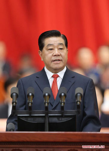 Jia Qinglin delivers a report on the work of the Chinese People's Political Consultative Conference (CPPCC) National Committee's Standing Committee at the first session of the 12th CPPCC National Committee at the Great Hall of the People in Beijing, capit