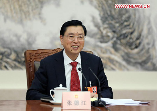 Zhang Dejiang, executive chairperson of the presidium of the first session of the 12th National People's Congress (NPC), presides over the first meeting of the presidium's executive chairpersons at the Great Hall of the People in Beijing, capital of China