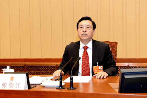 Zhang Dejiang presides over the first meeting of the presidium of the first session of the 12th National People's Congress (NPC) at the Great Hall of the People in Beijing, capital of China, March 4, 2013. (Xinhua/Ma Zhancheng)