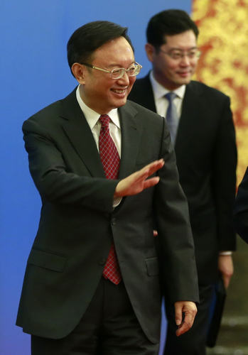 Foreign Minister Yang Jiechi acknowledges the media after his news conference on China's foreign policy on Saturday. [FENG YONGBIN / CHINA DAILY]