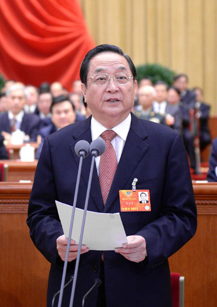 Yu Zhengsheng, chairman of the National Committee of the Chinese People's Political Consultative Conference (CPPCC), presides over the closing meeting of the first session of the 12th CPPCC National Committee at the Great Hall of the People in Beijing, ca