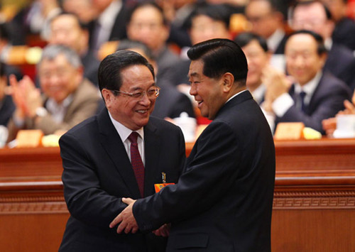 Former top political adviser Jia Qinglin (right) congratulates his successor Yu Zhengsheng, who was elected chairman of the 12th National Commission of the Chinese People's Political Consultative Conference on Monday. [Zou Hong / China Daily]
