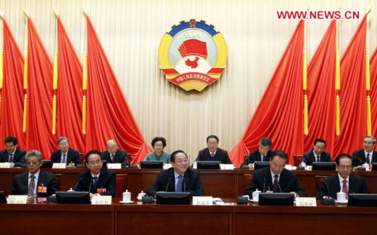 Yu Zhengsheng (C front), a member of the Standing Committee of the Political Bureau of the Communist Party of China (CPC) Central Committee, who is also chairman of the 12th National Committee of the Chinese People's Political Consultative Conference (CPPCC), presides over the closing meeting of the first conference of the Standing Committee of the 12th CPPCC National Committee in Beijing, capital of China, March 13, 2013. (Xinhua/Ju Peng)