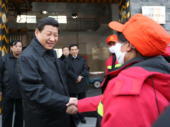 In this file photo taken on Feb. 8, 2013, Xi Jinping (L, front) meets with sanitation workers in the Shoupakou cleaning station of the sanitation center of the Xicheng District in Beijing, capital of China. (Xinhua/Liu Weibing)