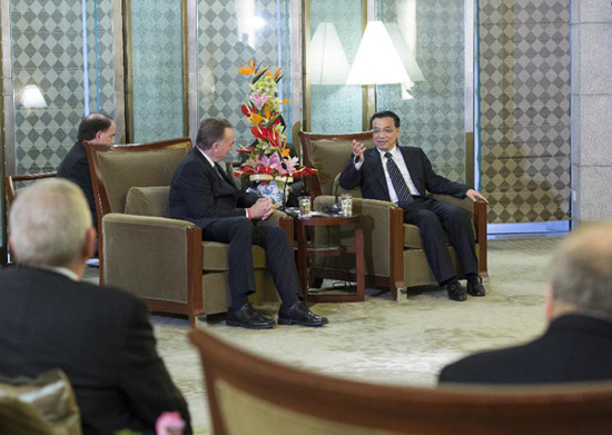 In this file photo taken on Dec. 12, 2012, Li Keqiang (R) meets with foreign guests attending the 2012 Annual General Meeting of China Council for International Cooperation on Environment and Development in Beijing, capital of China. (Xinhua/Wang Ye)