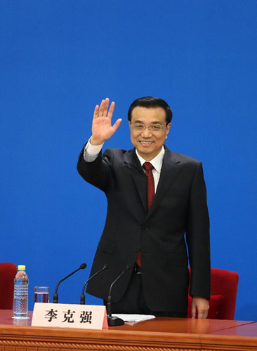 Chinese Premier Li Keqiang greets the journalists at a press conference after the closing meeting of the first session of the 12th National People's Congress (NPC) at the Great Hall of the People in Beijing, capital of China, March 17, 2013. Chinese Premi