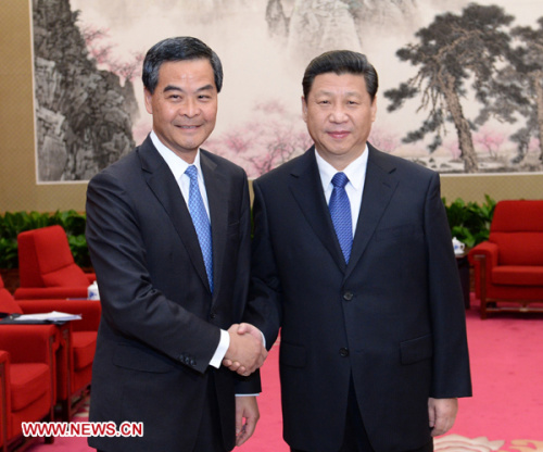 Chinese President Xi Jinping (R) meets with CY Leung, chief executive of Hong Kong Special Administrative Region, in Beijing, capital of China, March 18, 2013. (Xinhua/Liu Jiansheng)