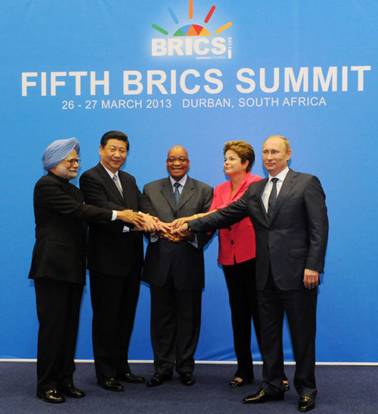 BRICS leaders, from left, Indian Prime Minister Manmohan Singh, President Xi Jinping, South African President Jacob Zuma, Brazil's President Dilma Rousseff and Russian President Vladimir Putin display a united front at their summit in Durban, South Africa