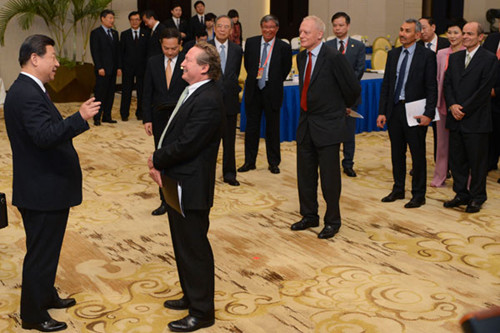 President Xi Jinping shares a light moment during his meeting with business leaders attending the Boao Forum for Asia Annual Conference 2013 in Boao, Hainan province, on Monday. Liao Pan / China News Service