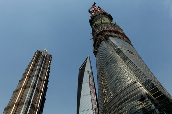 The Shanghai Tower, which is under construction, has reached 501.3 meters, April 11, 2013. It will become China's tallest building after reaching 632 meters in height in 2014. [Photo/Xinhua]