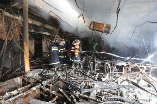 Firefighters work at the accident site after a fire occurred at a hotel in Fancheng District of Xiangyang City, central China's Hubei Province, April 14, 2013. (Xinhua Photo)