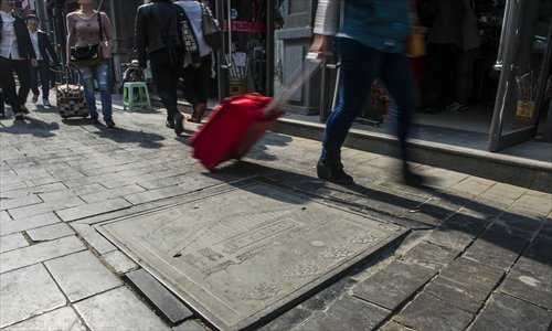 A manhole cover inscribed with incorrect Chinese characters on a street in Dashilan, Xicheng district. Photo: Li Hao/GT