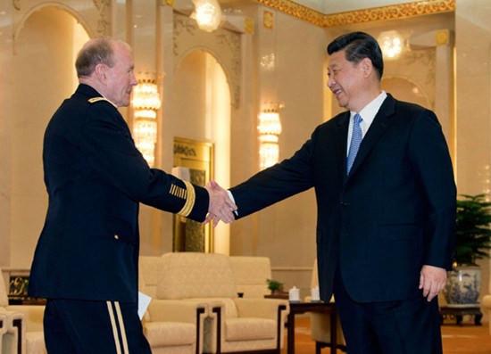 President Xi Jinping greets Chairman of the US Joint Chiefs of Staff General Martin Dempsey at the Great Hall of the People in Beijing on Tuesday. Andy Wong / Reuters