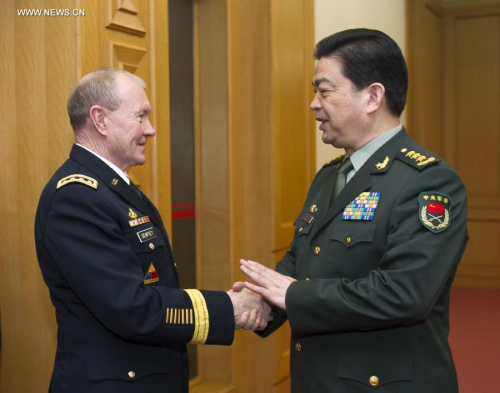 Chinese State Councilor and Defense Minister Chang Wanquan (R) shakes hands with Martin Dempsey, chairman of the U.S. Joint Chiefs of Staff, in Beijing, capital of China, April 23, 2013. (Xinhua/Xie Huanchi)