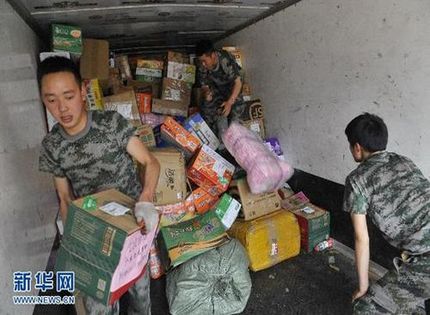 Every day, relief supply distribution is a major event at relocation sites in Lushan county.