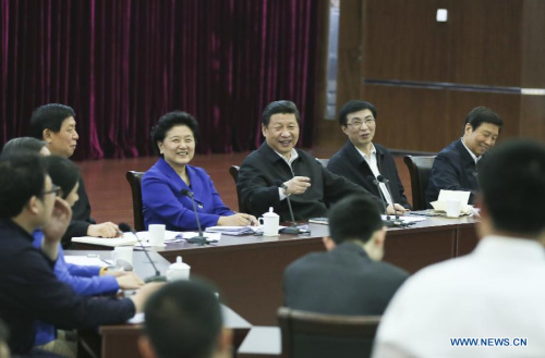 Chinese President Xi Jinping (back, C) talks at a discussion with representatives of model youth to mark the country's Youth Day on Saturday at China Academy of Space Technology in Beijing, capital of China, May 4, 2013. Xi on Saturday called on Chinese young people to contribute to the revitalization of the nation and hone themselves at grassroots. (Xinhua/Lan Hongguang)