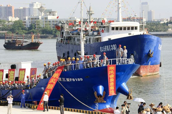 A fishing fleet prepares to set sail for Nansha Islands from Danzhou, Hainan province. The operation will last about 40 days. Huang Yiming / China Daily