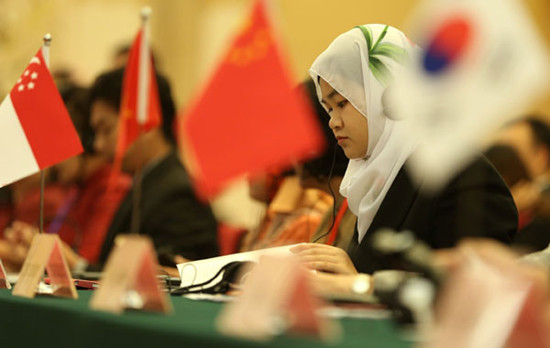 Delegates take part in the Fifth East Asia Gender Equality Ministerial Meeting in Beijing on Wednesday. Some 120 delegates from 13 countries in East Asia attended. JIN LIWANG / XINHUA