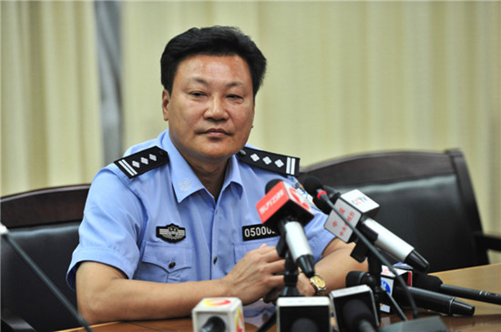 Ye Qing, a police officer from Wanning Public Security Bureau, who confirmed the arrests of the two men. [Photo by Hai Nan / for China Daily]
